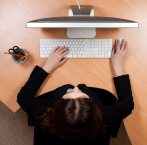 overhead shot of a person using a computer.