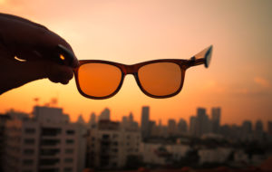 Sunglasses against a city backdrop