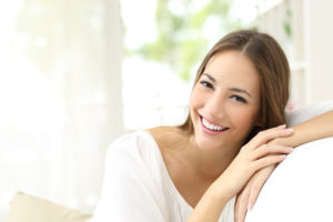 Portrait of a woman smiling at the camera.